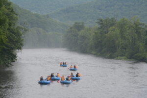 Participants rafting down a river