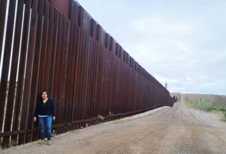 In front of a border wall